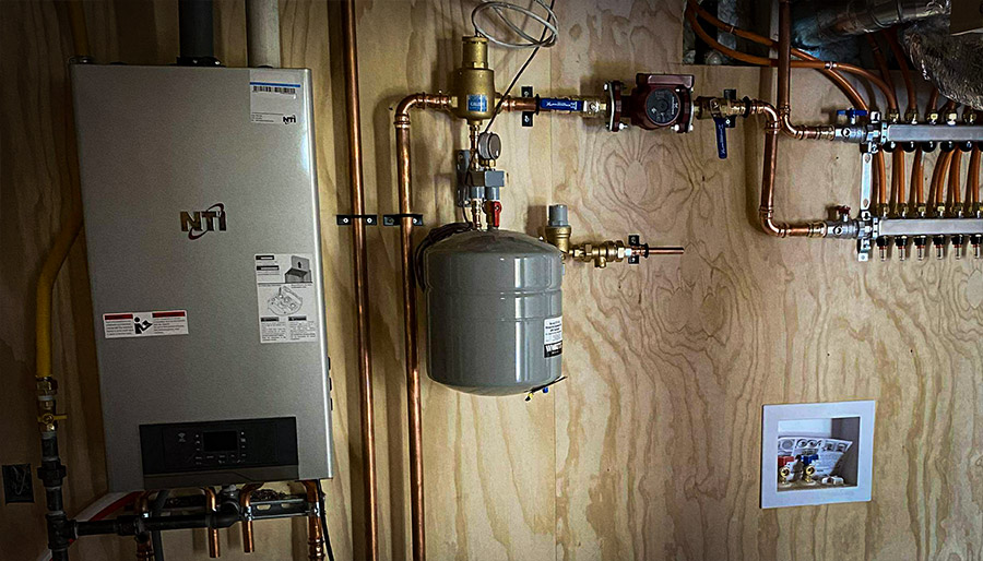 Natural granite stonework integrated into Canadian Shield cottage landscape